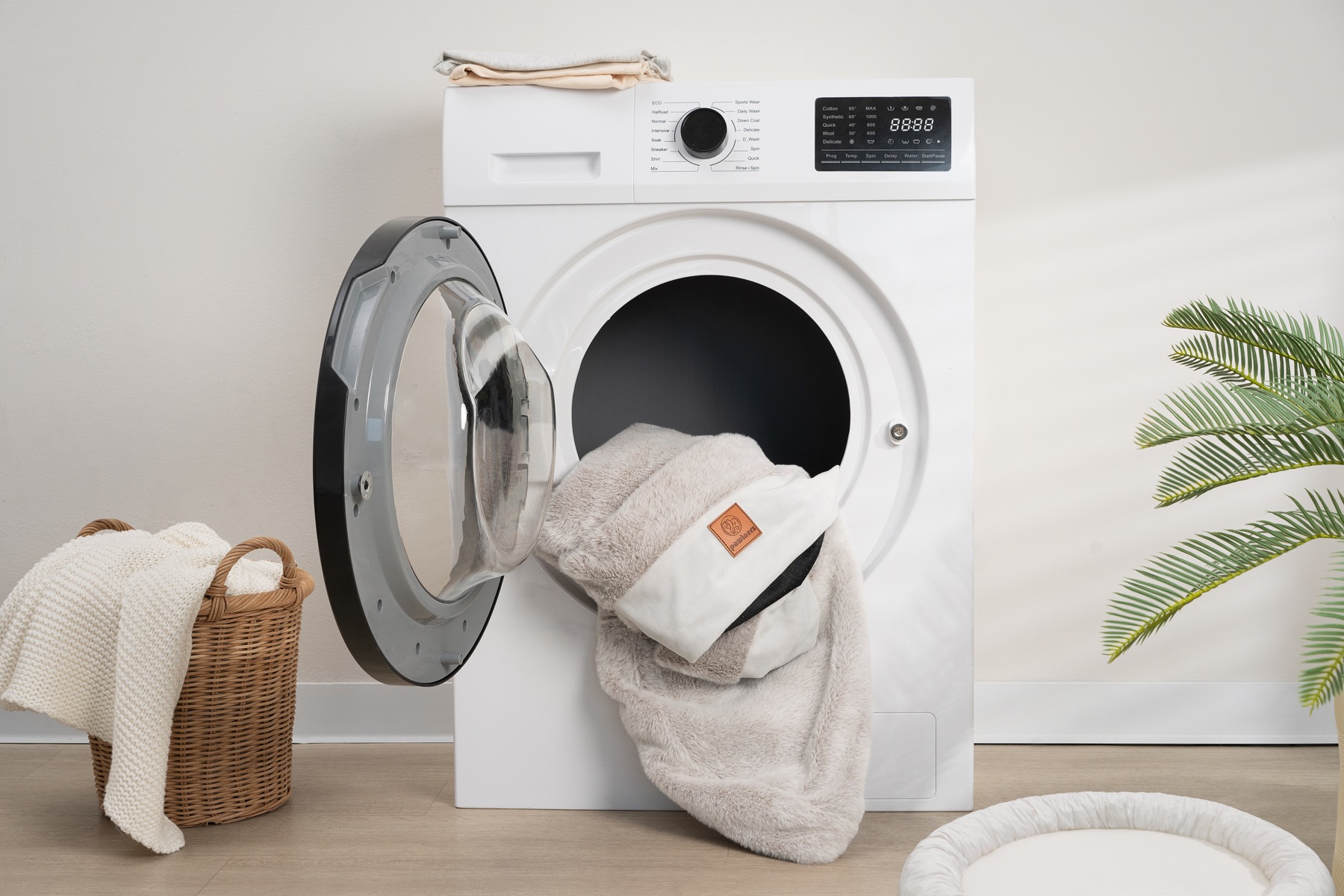 Pawtnerz bed cover shown at a washing machine